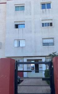 a building with a gate in front of it at Appartement à RABAT AGDAL in Rabat