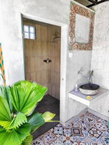 Koupelna v ubytování Mandia Bungalows