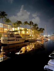 a group of boats docked in a marina at night at Nice Boat in Key Largo in Key Largo