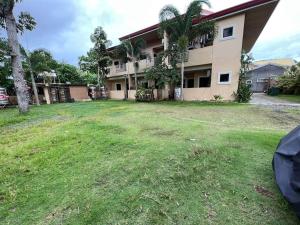 an empty yard in front of a house at Nielo Apartment Door 6 in Dapitan