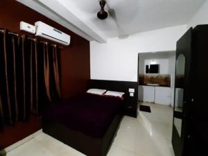 manjunatha residency客房内的一张或多张床位