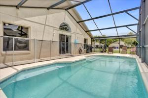 an indoor swimming pool with a glass ceiling at 3 Bedrooms - 2 Bathrooms - Cumbrian Lakes 4695 Cl in Orlando