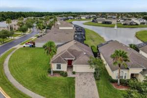 an aerial view of a house with a river at 3 Bedrooms - 2 Bathrooms - Cumbrian Lakes 4695 Cl in Orlando
