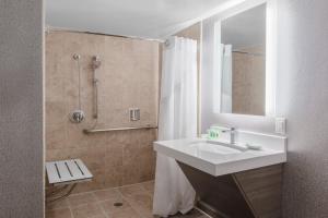 a bathroom with a sink and a shower at Holiday Inn La Mirada Buena Park by IHG in La Mirada