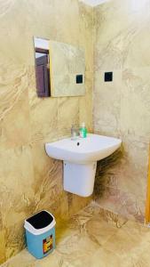 a bathroom with a sink and a mirror at Colombo Villa Near Bolgoda Lake 5 Bed 2.5 Bath in Piliyandala