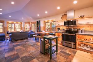 a kitchen and living room with a table and chairs at House on Metolius in Camp Sherman
