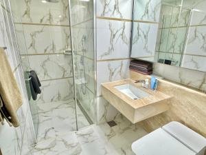 a bathroom with a shower and a sink and a toilet at Stay G7 Busan Station in Busan