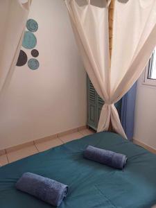 Postel nebo postele na pokoji v ubytování Ô Licuala Villa + 12 fotografií