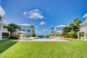 a view of the backyard of a villa at Beautiful Beachfront Apartment! in Seven Mile Beach