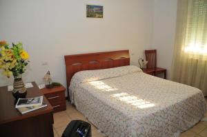 A bed or beds in a room at Casablanca