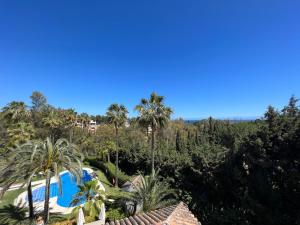 an aerial view of a resort with a swimming pool and trees at Apartment in Marbella Golden Mile in Marbella