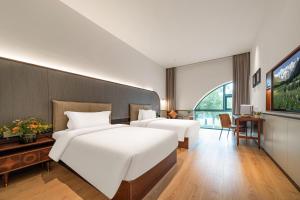 Wuyu Hotel, Jinyun Mountain & Southwest University客房内的一张或多张床位