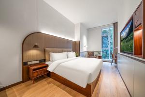 Wuyu Hotel, Jinyun Mountain & Southwest University客房内的一张或多张床位