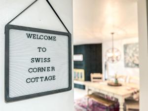 a sign that reads welcome to swiss corner cottage at Swiss Corner Cottage - Private-Heated Indoor Pool in Santa Clara +86 photos