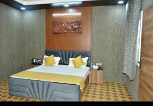 Postel nebo postele na pokoji v ubytování Hotel Pearl Residency