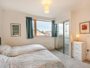 a bedroom with a bed and a window at Seaview in Parkeston