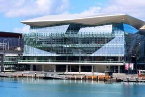 a large glass building with a marina in front of it at Great value, Near Darling harbour, Cbd, ICC,Casino in Sydney