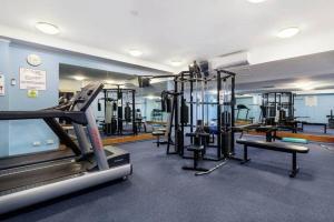a gym with several tread machines in a room at Great value, Near Darling harbour, Cbd, ICC,Casino in Sydney