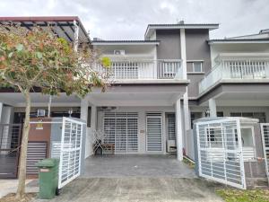 a house with two white gates in front of it at 1793 Kepayang S2 # U Homestay in Seremban