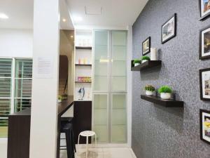 a room with a desk and a wall with shelves at Tambun lost world luxury villa 5BR/20 pax/mahjong/karaok/bbq/garden events in Tambun +98 photos