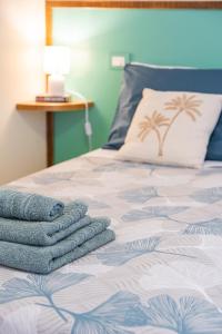 Ένα ή περισσότερα κρεβάτια σε δωμάτιο στο Il dolce Rifugio di Carlotta con vista su Orvieto