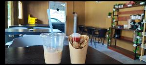 a drink and a cookie in a cup on a table at Green Forest Resort in Setiu