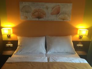 Postel nebo postele na pokoji v ubytování Casino & Hotel Admiral Strážný