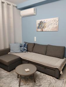 a living room with a couch and a table at Black Eagle Apartment in Drama