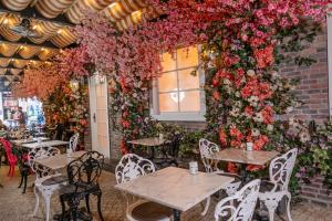 a restaurant with tables and flowers on a wall at Ring Stone Hotels Bosphorus - Special Class in Istanbul