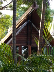a log cabin in the woods with trees at Treellion Jungloo in Phnom Penh