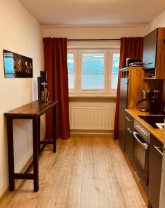 a kitchen with a table and a counter top at Ferienwohnung Elfi in Kirchdorf im Wald