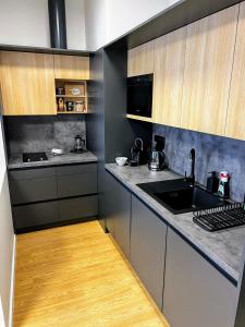 a kitchen with a sink and a counter top at Home Heart of the center of Brno - Koliště Passage in Brno