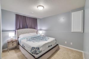 a small bedroom with a bed and a window at Charming Retreat With Modern Comforts in West Fargo