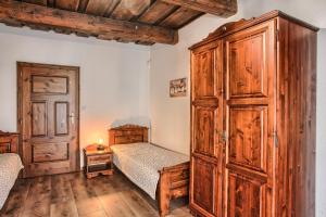 Posteľ alebo postele v izbe v ubytovaní Drevenica v Hybe