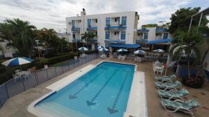 een afbeelding van een zwembad in een hotel bij Hotel Miami en Melgar in Melgar