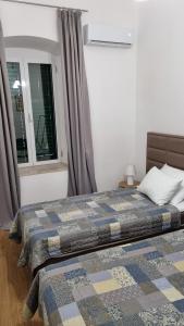 Tempat tidur dalam kamar di Main Square View