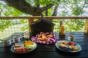 a table with two plates of food on it at North-House Orava in Veličná