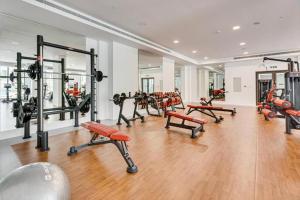 a gym with a bunch of equipment in a room at Livbnb Suites - Madinat Jumeirah Living - Cozy 2 Bedroom near Burj Al Arab in Dubai