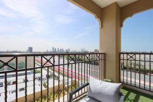 a balcony with a view of a highway at Livbnb Suites - Madinat Jumeirah Living - Cozy 2 Bedroom near Burj Al Arab in Dubai