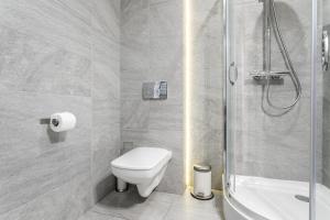 a bathroom with a toilet and a shower at Old Town Residence Bis in Krakow