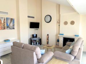 A television and/or entertainment centre at Benalmadena Harbour Penthouse with big terrace and sea view
