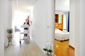 Voodi või voodid majutusasutuse Hotel Rex toas