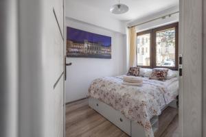 Posteľ alebo postele v izbe v ubytovaní Apartamenty City Center - Zdrojowe