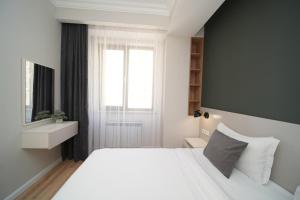 Krevet ili kreveti u jedinici u okviru objekta Sweet Home Apart-Hotel