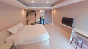 Postel nebo postele na pokoji v ubytování PKK hotel Residence