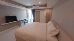 Postel nebo postele na pokoji v ubytování PKK hotel Residence