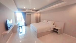 Postel nebo postele na pokoji v ubytování PKK hotel Residence