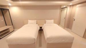 Postel nebo postele na pokoji v ubytování PKK hotel Residence
