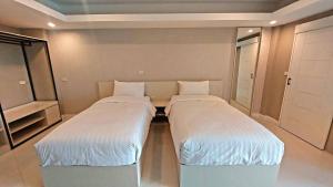 Postel nebo postele na pokoji v ubytování PKK hotel Residence