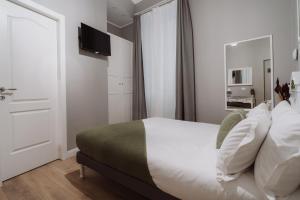 Postel nebo postele na pokoji v ubytování Rooms Genova dei Rolli